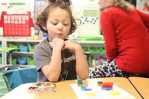 Kindergarten student working on activity