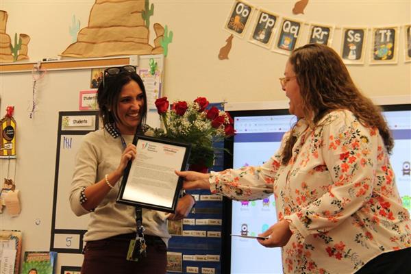  Danielle Swartz, a first-grade teacher at Amphi schools’ Innovation Academy, accepts her award
